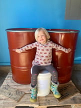Lily with honey barrels